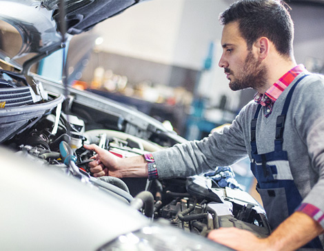 Mechanic working on vehicle